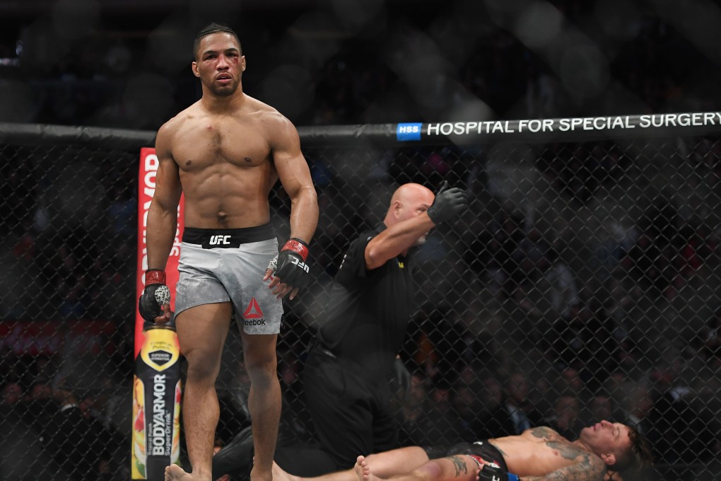 Kevin Lee walks off after knocking Gregor Gillespie out with a head kick. Photo: USA TODAY Sports