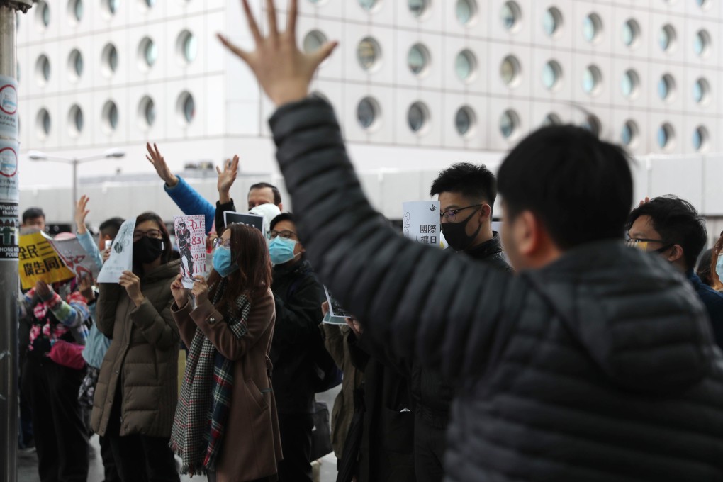 A small group of anti-government protesters hold a lunchtime rally in Central. Photo: Sam Tsang
