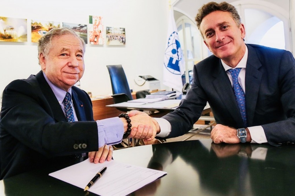 FIA chief Jean Todt and Formula E boss Alejandro Agag shake hands after signing the world championship agreement in Paris. Photo: FIA
