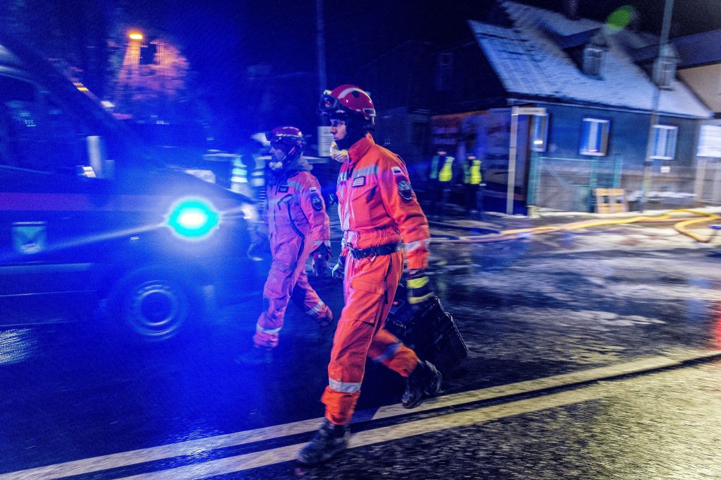 Firefighters work at the site of a building levelled by a gas explosion in Szczyrk. Photo: Handout via Reuters