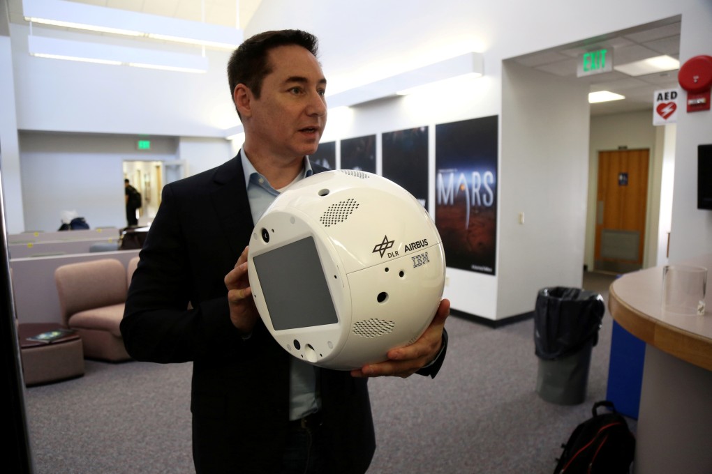 Bret Greenstein, IBM Global Vice President of Watson Internet of Things Offerings, holds a clone of the artificial intelligence bot named CIMON in June 2018. Photo: Reuters