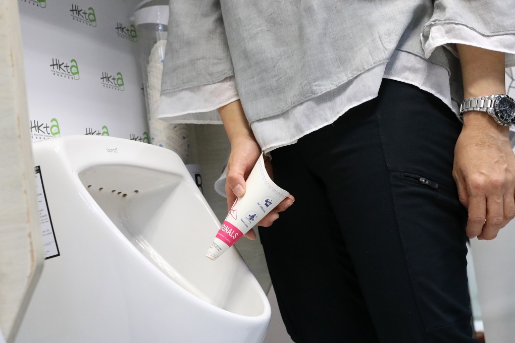 A user shows the female urinal. Photo: KY Cheng