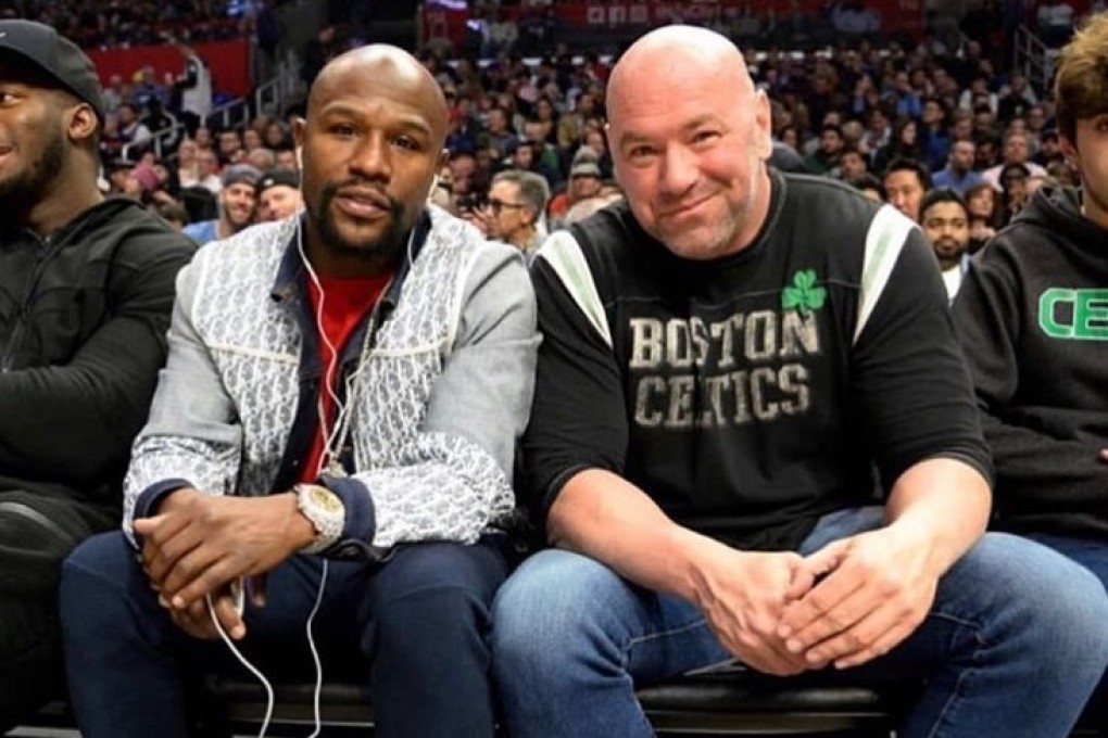 Floyd Mayweather sits with Dana White at an NBA game between the Los Angeles Clippers and the Boston Celtics. Photo: Instagram