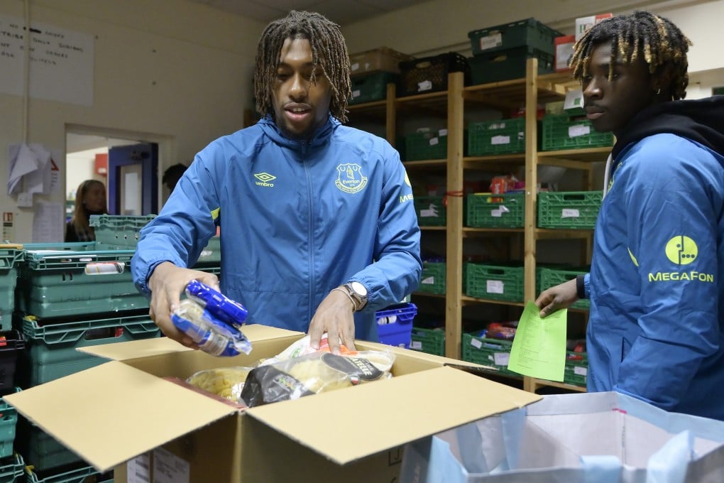Everton players Moise Kean and Alex Iwobi visit the North Liverpool Food Bank as part of the club’s efforts to offer support in the fight against poverty in Merseyside. Photo: Tony McArdle/Everton FC via Getty Images