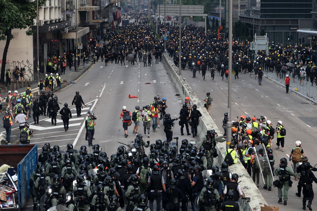 A stand-off between protesters and riot police on Wai Yip Street in Kwun Tong, Hong Kong, on August 24. Photo: Sam Tsang