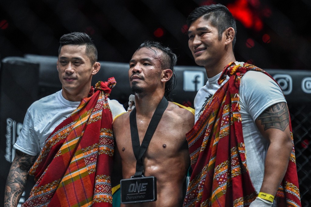 Martin Nguyen (left) and Aung La N Sang celebrate with Tial Thang. Photos: One Championship