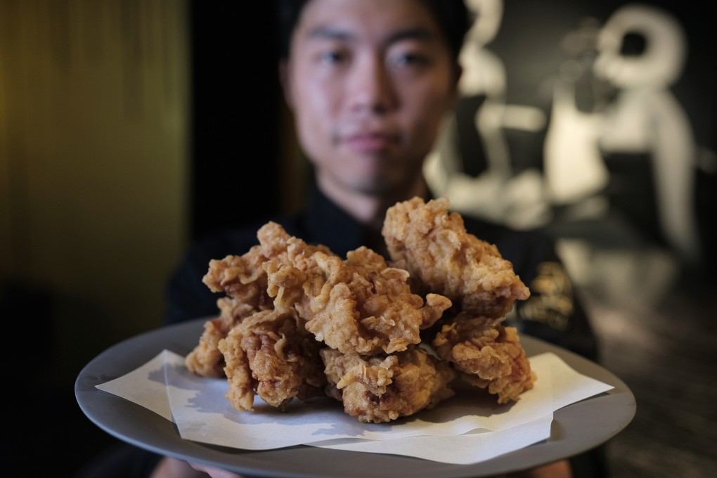 Chef Yong Soo-do with his Korean fried chicken, whose preparation includes marinating it overnight in brine, then putting it in a tempura batter with home-made chicken powder. Photo: Tory Ho
