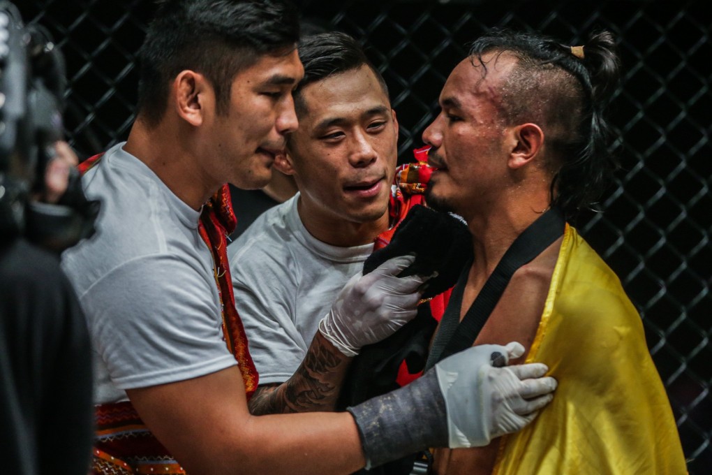 Martin Nguyen (centre) congratulates Tial Thang (right) with Aung La N Sang. Photo: One Championship