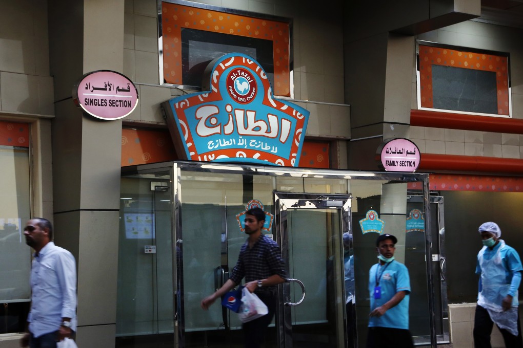 A restaurant with signs at top left reads, “single section,” and at top right reads, “family section”. Photo: AP Photo