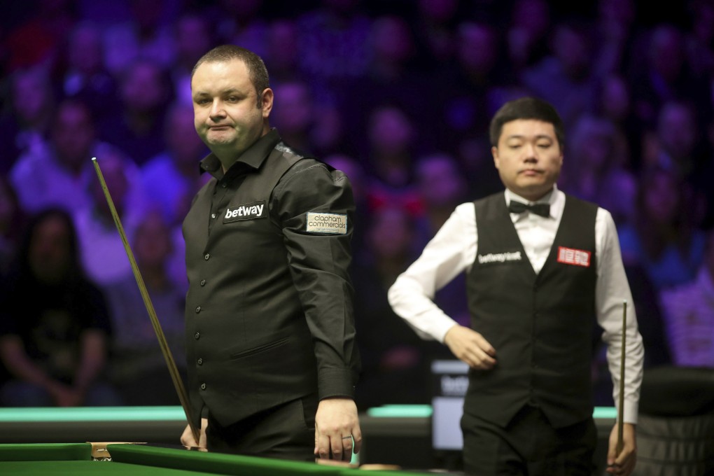 Britain's Stephen Maguire and China's Ding Junhui look on during the final of the 2019 UK Championship. Photo: AP