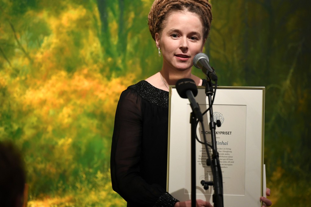 Swedish Minister for Culture and Democracy Amanda Lind presents the Tucholsky Prize to detained bookseller Gui Minhai in Stockholm on November 15. Photo: Reuters