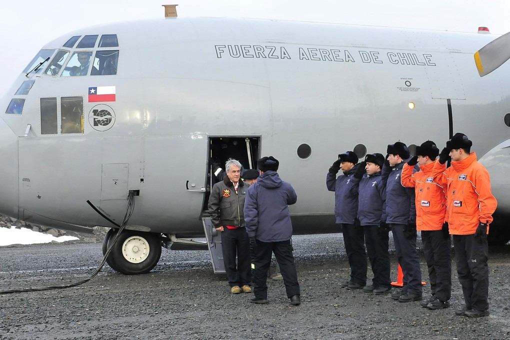 Chilean President Sebastian Pinera visits Chile's Presidente Eduardo Frei Montalva base, in Antarctica's King George Island, in 2012. A C-130 Hercules like this has been reported missing. File photo: AFP