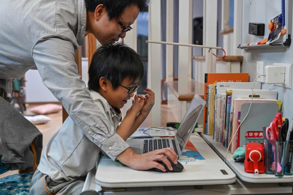 Zhou Ziheng began teaching his son Vita how to write codes when he was five. Photo: AFP