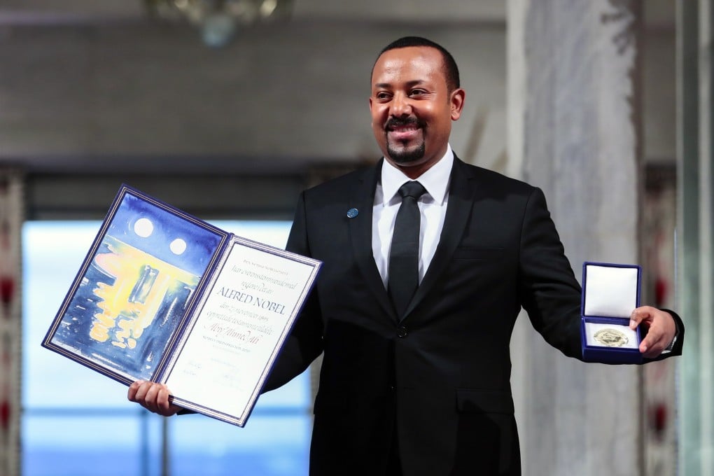 Ethiopian Prime Minister Abiy Ahmed takes a picture after receiving the Nobel Peace Prize during the award ceremony in Oslo City Hall, Norway. Photo: NTB Scanpix via AP