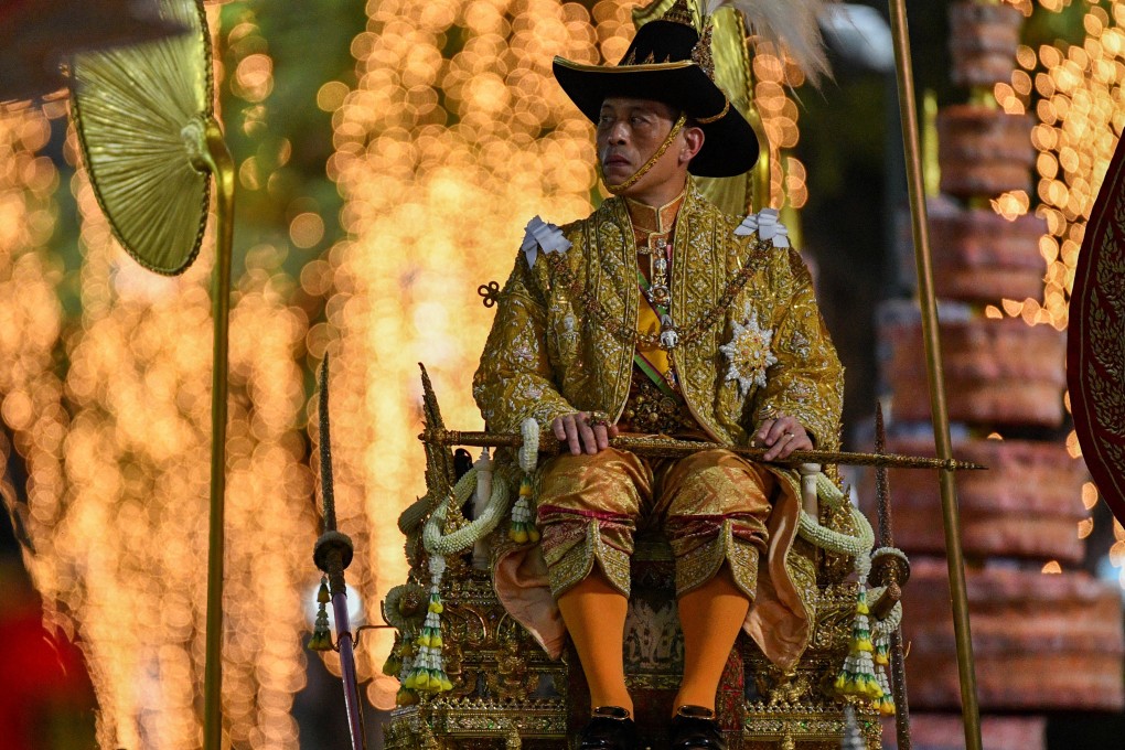 Thai King Maha Vajiralongkorn is carried on a sedan-chair after taking part in the royal barge procession near the Grand Palace in Bangkok. Photo: Reuters