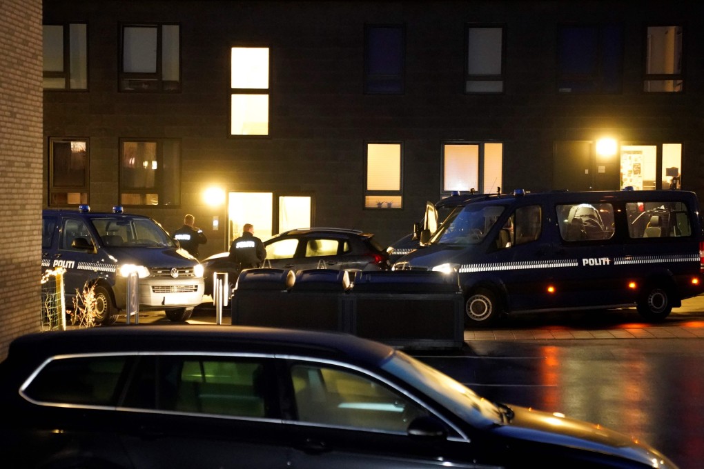 Police cars parked in front of houses in Aalborg during the anti-terror operation. Photo: AFP