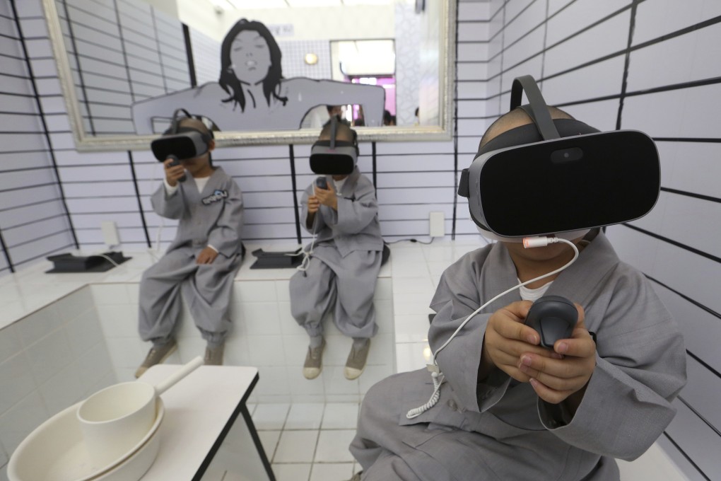 Boys wear virtual reality devices to experience 5G services at a LG Uplus 5G experience centre in Seoul. South Korea launched the world’s first commercial 5G network in April. Photo: AP