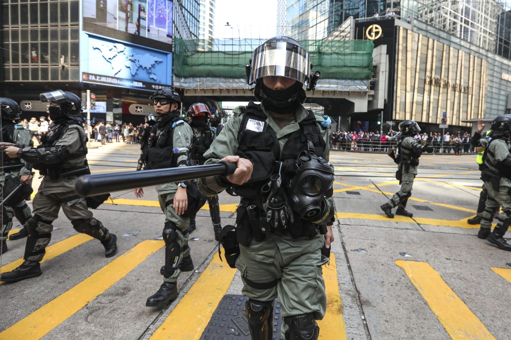 Riot police in action during a lunchtime rally in Central on November 20. Photo: Xiaomei Chen