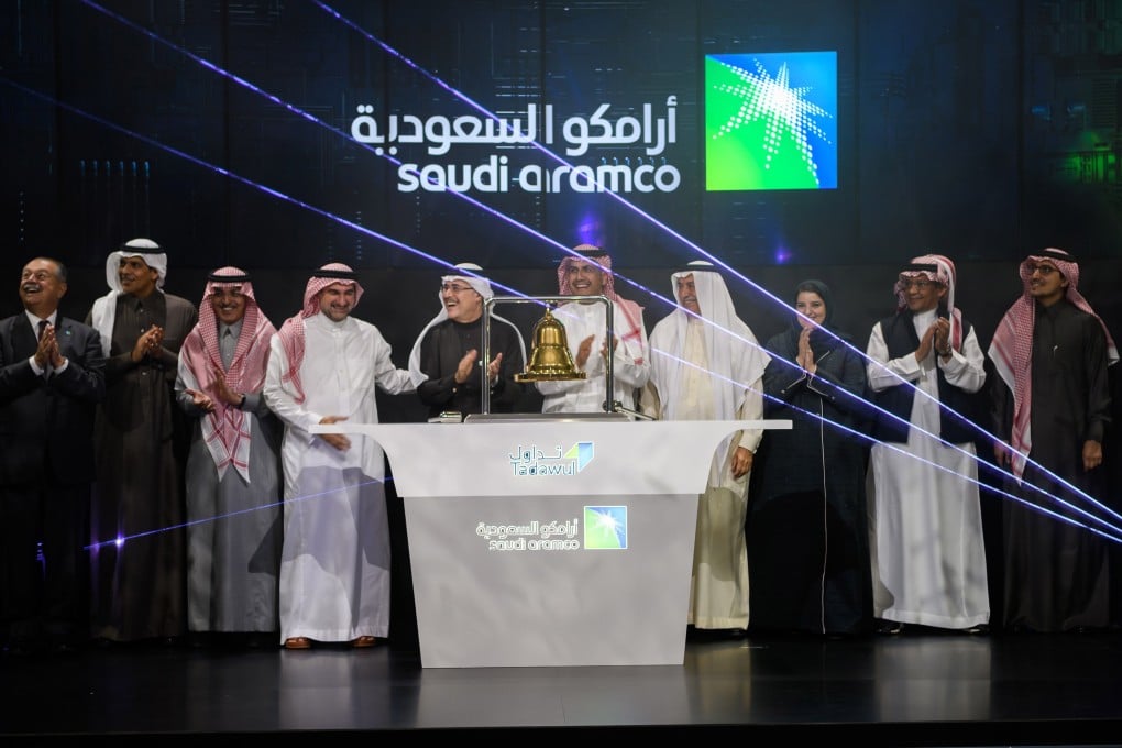 Officials of Saudi Aramco and Saudi stock exchange attend a ceremony to mark the debut of state-owned oil company’s IPO in Riyadh, Saudi Arabia, on Wednesday. Photo: EPA-EFE