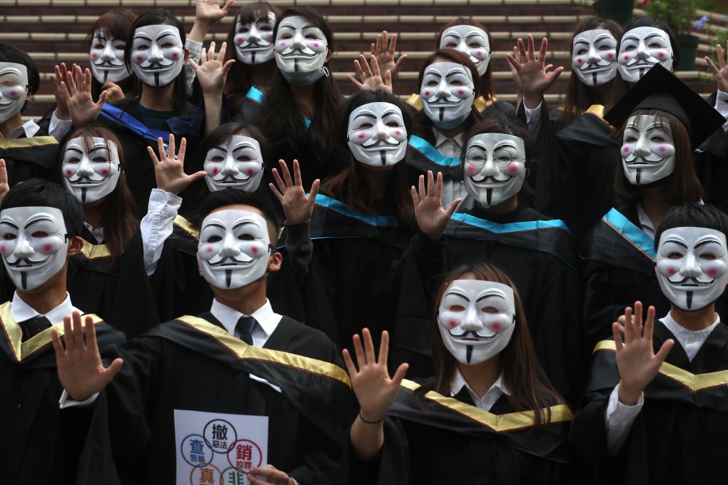 Graduates join a flash mob protest at Polytechnic University in Hung Hom. Photo: Sam Tsang