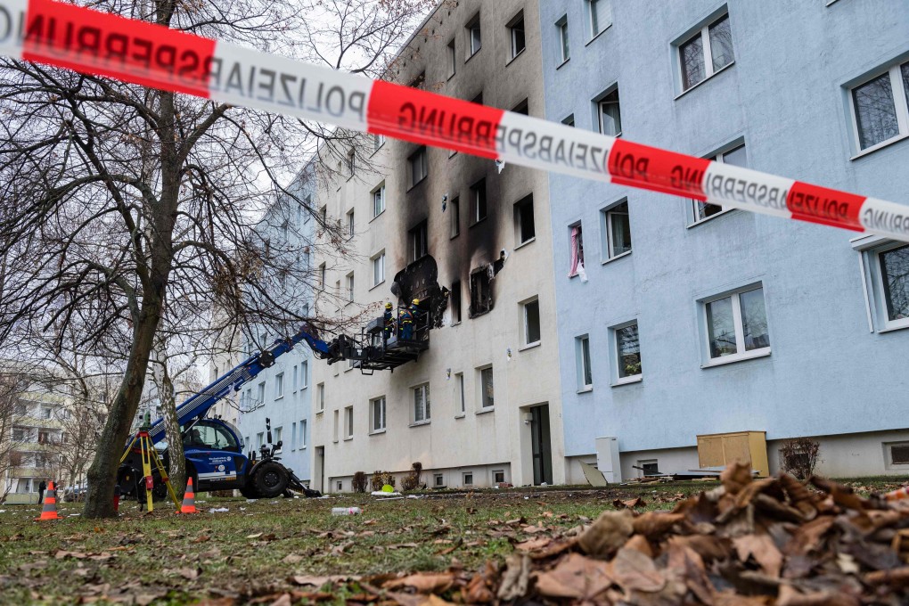 Rescue workers from the Federal Agency for Technical Relief work at a damaged apartment building. Photo: AFP