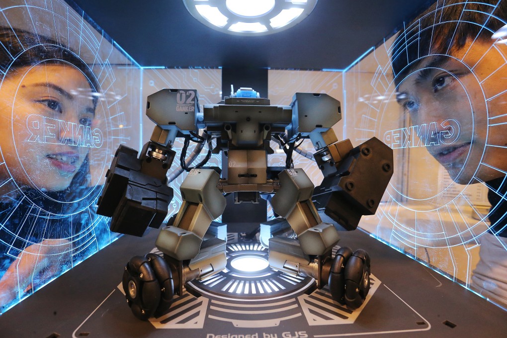 People look at a smart robot on display at the Hong Kong Convention and Exhibition Centre in January 2018. Technology is rapidly shaping society and creating new jobs. Photo: Dickson Lee