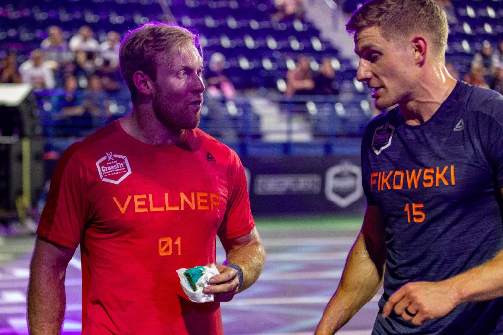 Patrick Vellner enjoying some birthday cake alongside fellow Canadian Brent Fikowski after the final event of day three. Photo: Dubai CrossFit Championship/Adnan Karimjee