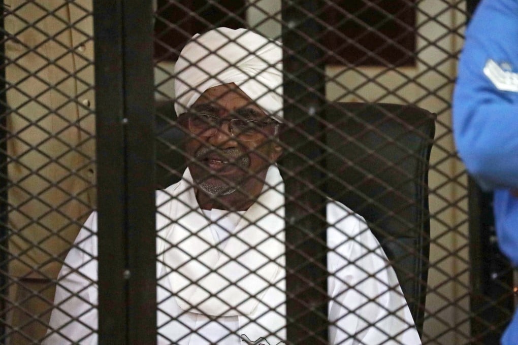 Omar al-Bashir sits in the defendant's cage during his trial in Khartoum, Sudan. Photo: EPA-EFE