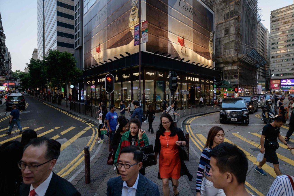 The Tsim Sha Tsui shopping district on October 17. Experts warn of a grim holiday season for businesses. Photo: AFP