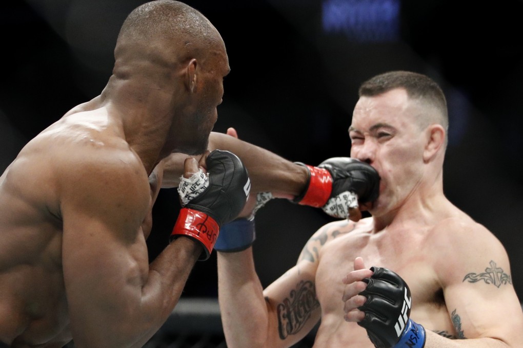 Kamaru Usman punches Colby Covington in the mouth at UFC 245. Photo: AP