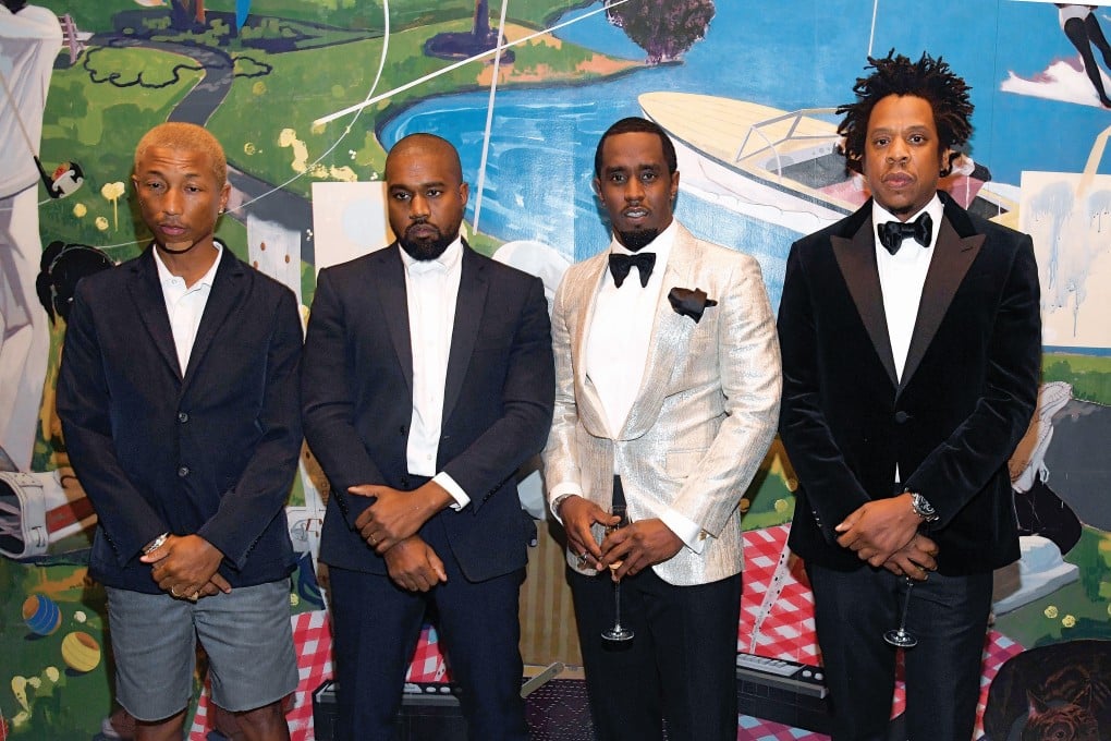 (From left) Pharrell Williams, Kanye West, Sean “Diddy” Combs and Jay-Z attend Combs’ 50th birthday party on December 14. Photo: Getty Images