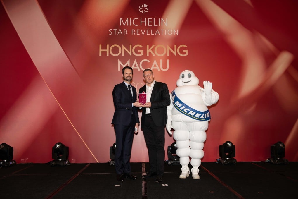 Michelin Guides’ Gwendal Poullennec presents a Michelin Star to Olivier Elzer of French fine-dining restaurant L'Envol, at the St Regis Hong Kong, in Macau on Tuesday. The 2020 edition of the Michelin Guide Hong Kong and Macau awards stars to 90 restaurants.