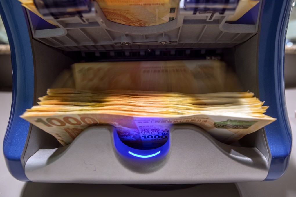 A stack of HK$1,000 banknotes running through a counting machine at the Hang Seng Bank in Hong Kong on Tuesday, April 16, 2019. Photo: Bloomberg
