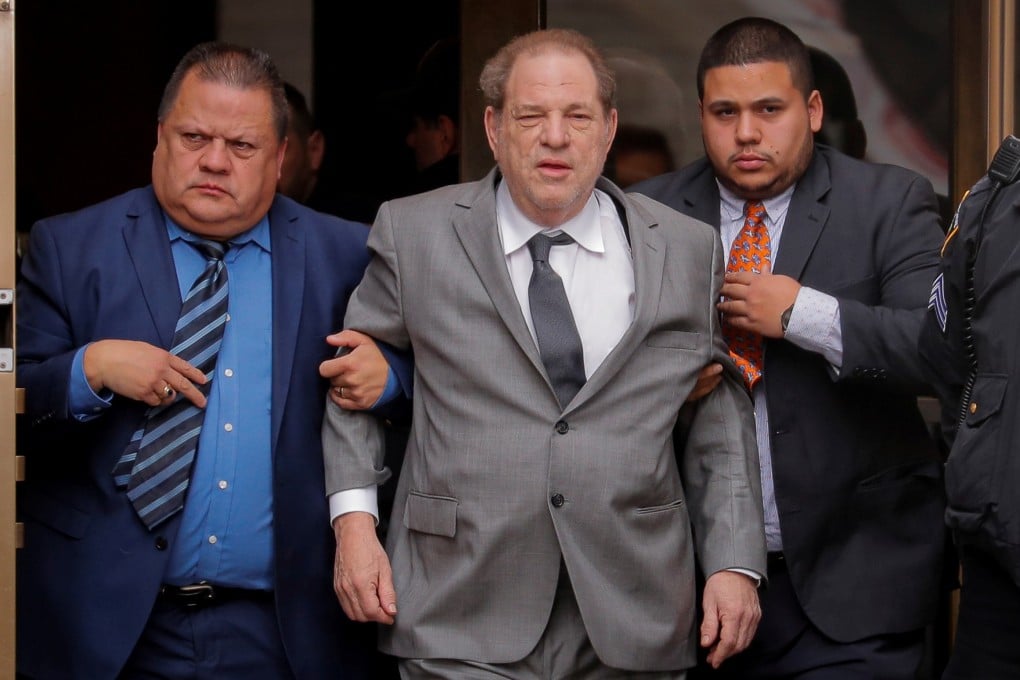 Film producer Harvey Weinstein (centre) exits following a hearing in his sexual assault case at New York State Supreme Court on December 6. Photo: Reuters