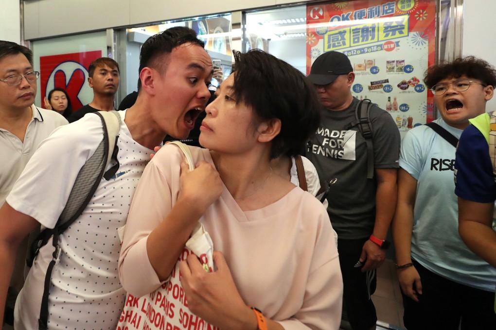 A man and woman clash as a fight breaks out between pro-Beijing supporters and anti-government protesters in Kowloon in September. Photo: Sam Tsang