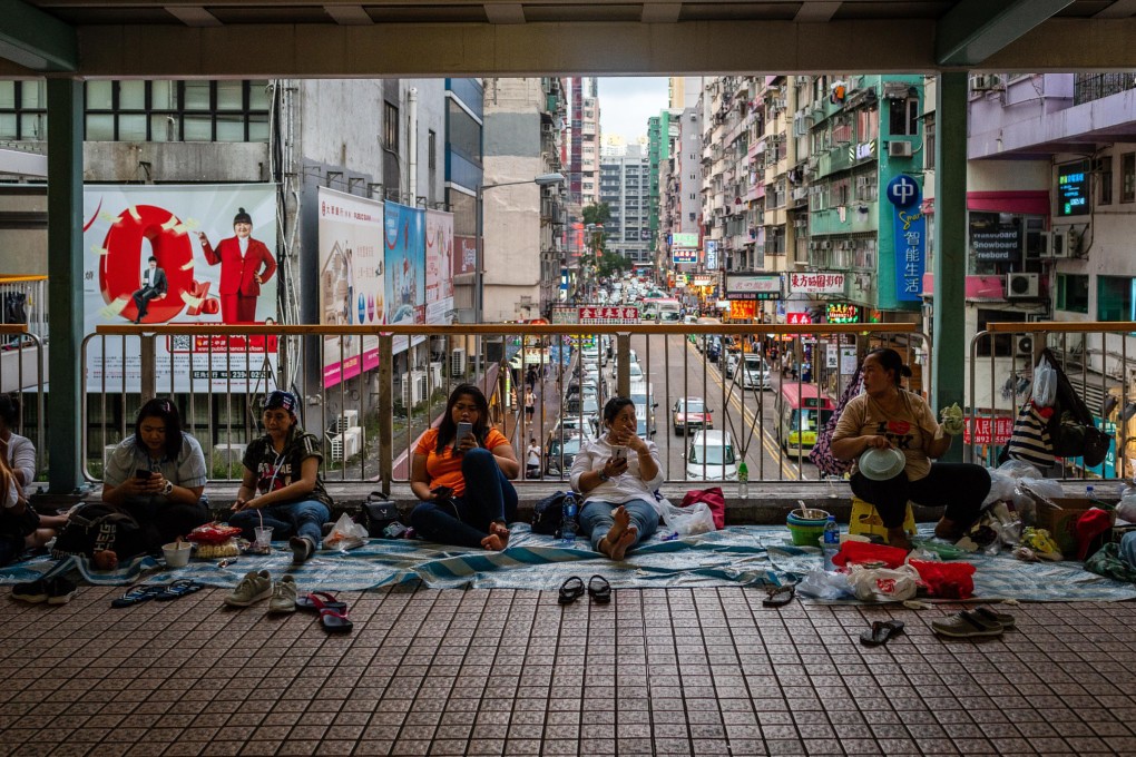 According to a recent study, 56 per cent of foreign domestic workers in Hong Kong were charged illegal fees by recruitment agencies. Photo: Bloomberg