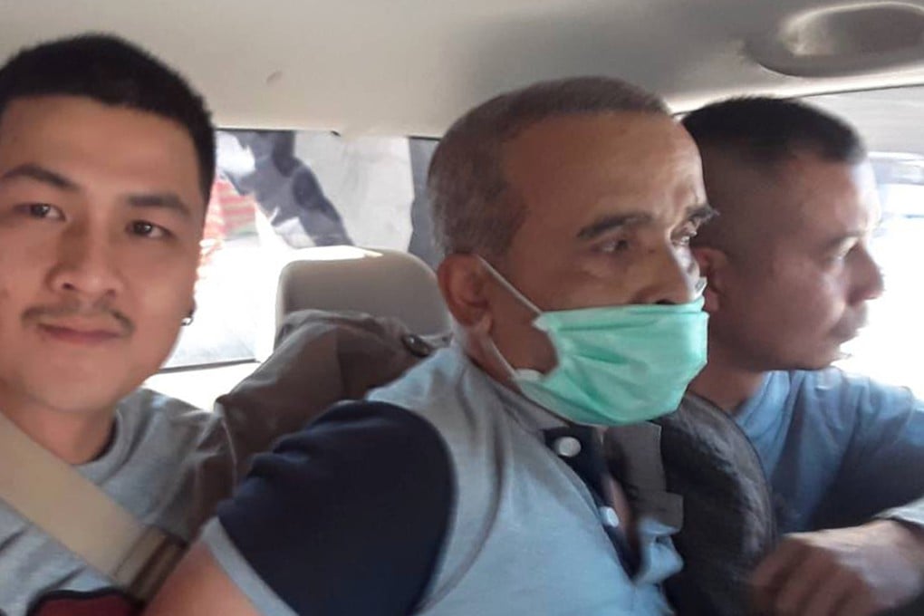 Thai serial killer Somkid Pumpuang (C) is escorted by Thai police officers after he was arrested at a railway station in Nakhon Ratchasima province, Thailand. Photo: EPA-EFE