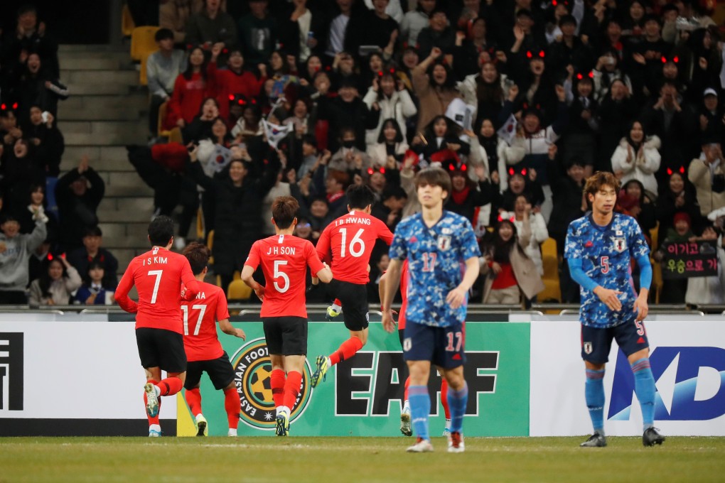 South Korea’s Hwang In-Beom celebrates scoring with teammates as Japan’s players walk away. Photo: Reuters