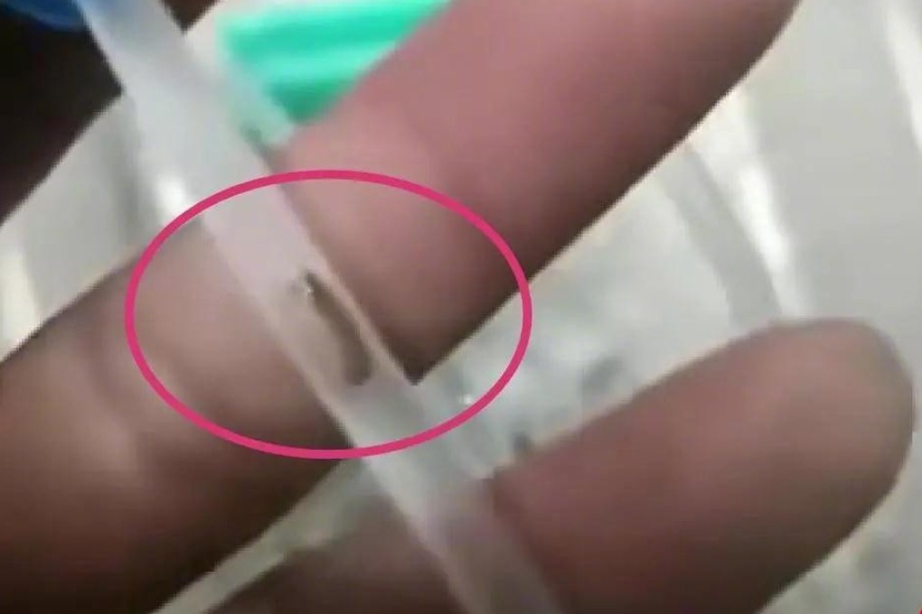 A father believes a worm-like object he discovered in an IV tube used to treat his son for flu at a Sichuan hospital may have given the three-year-old a bacterial infection. Photo: Weibo