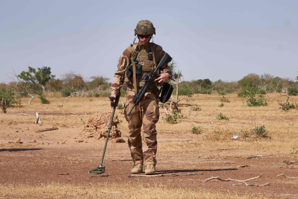 A French soldier searches for IEDs in northern Burkina Faso. Photo: AFP