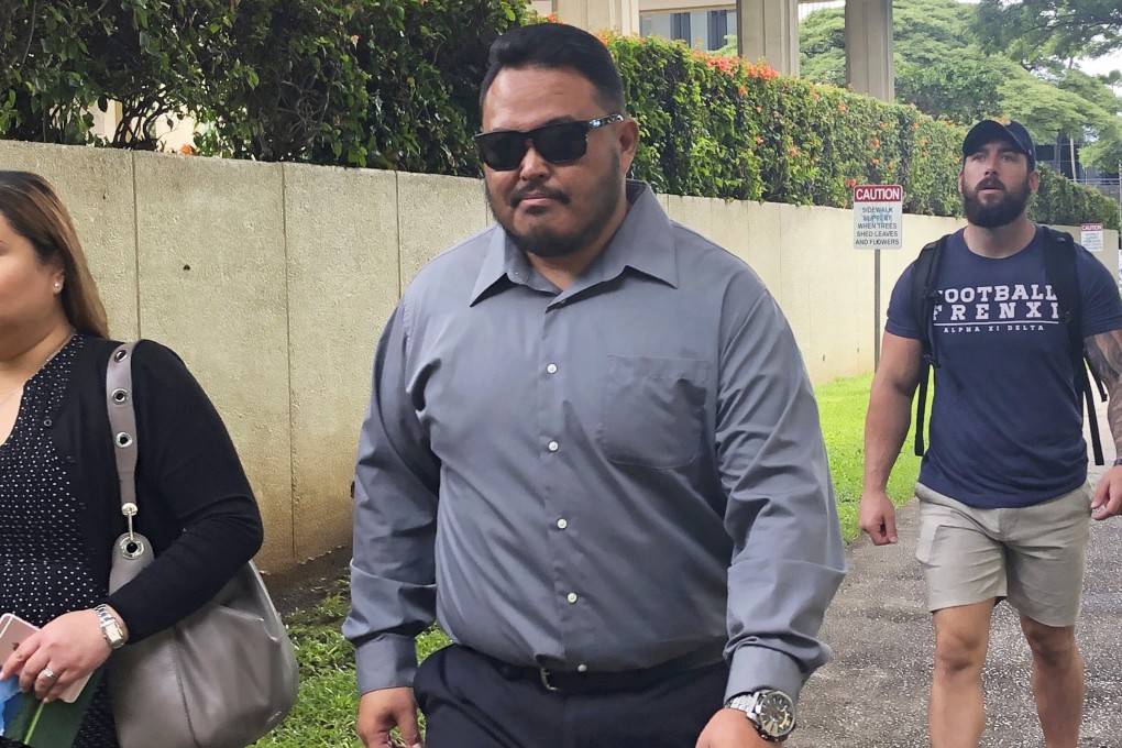 Former Honolulu police officer Reginald Ramones, centre, pictured in September. Photo: AP