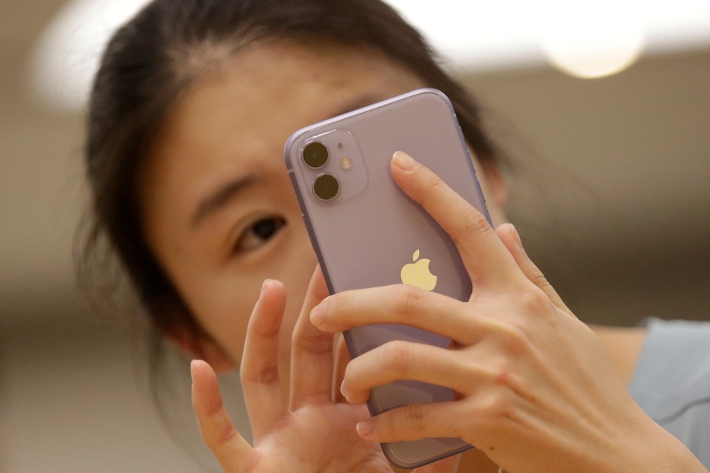 A customer tests Apple's iPhone 11 after it went on sale at the Apple Store in Beijing, September 20, 2019. Photo: Reuters