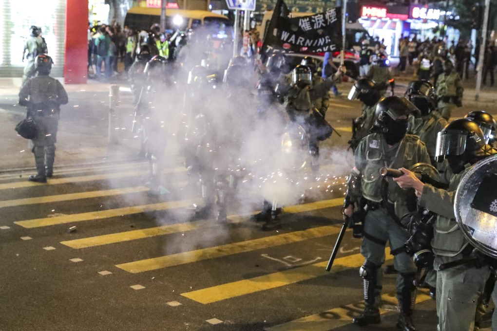 Riot police fire tear gas at anti-government protesters as they vandalise facilities in Whampoa in Hung Hom. Photo: Edmond So