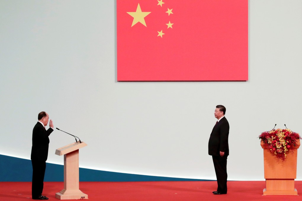 Macau Chief Executive Ho Iat-seng takes an oath in front of Chinese President Xi Jinping at a ceremony to inaugurate the fifth-term government of the Macau Special Administrative Region. Photo: Reuters