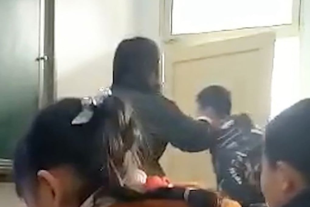 Video footage shows the teacher dragging the boy to the corner of the classroom and repeatedly slapping him in the face. Photo: Thepaper.cn