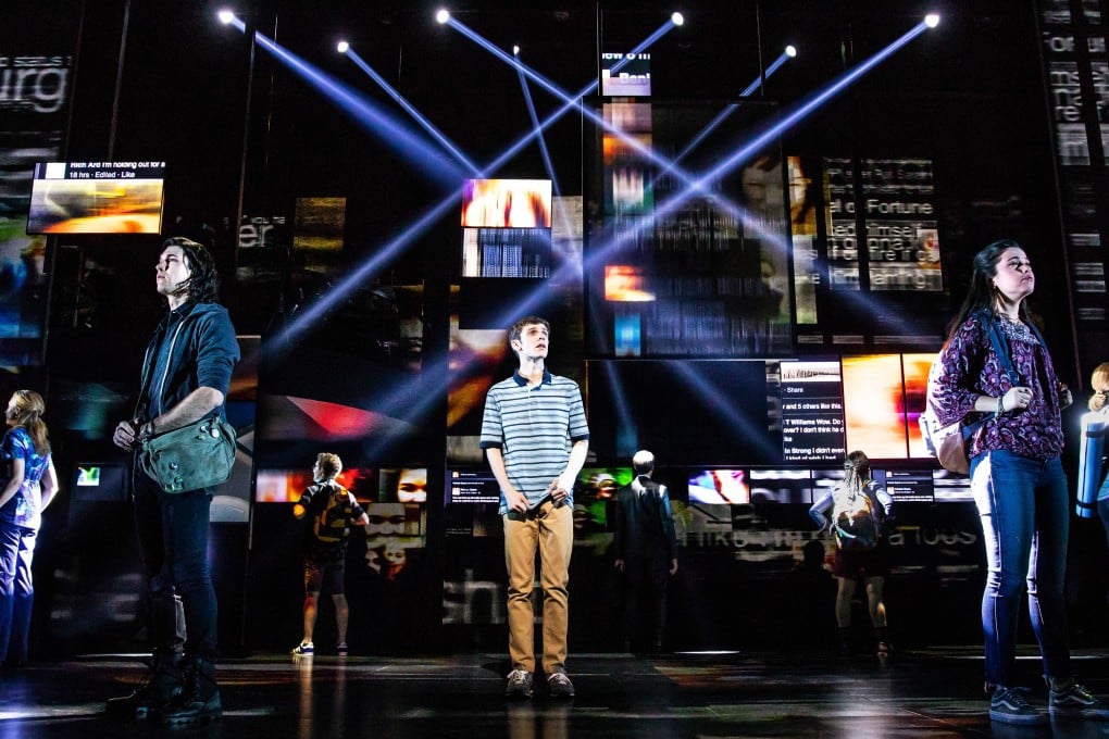 Social media feeds illuminate the Dear Evan Hansen set behind star Ben Levi Ross (centre). Photo: Matthew Murphy