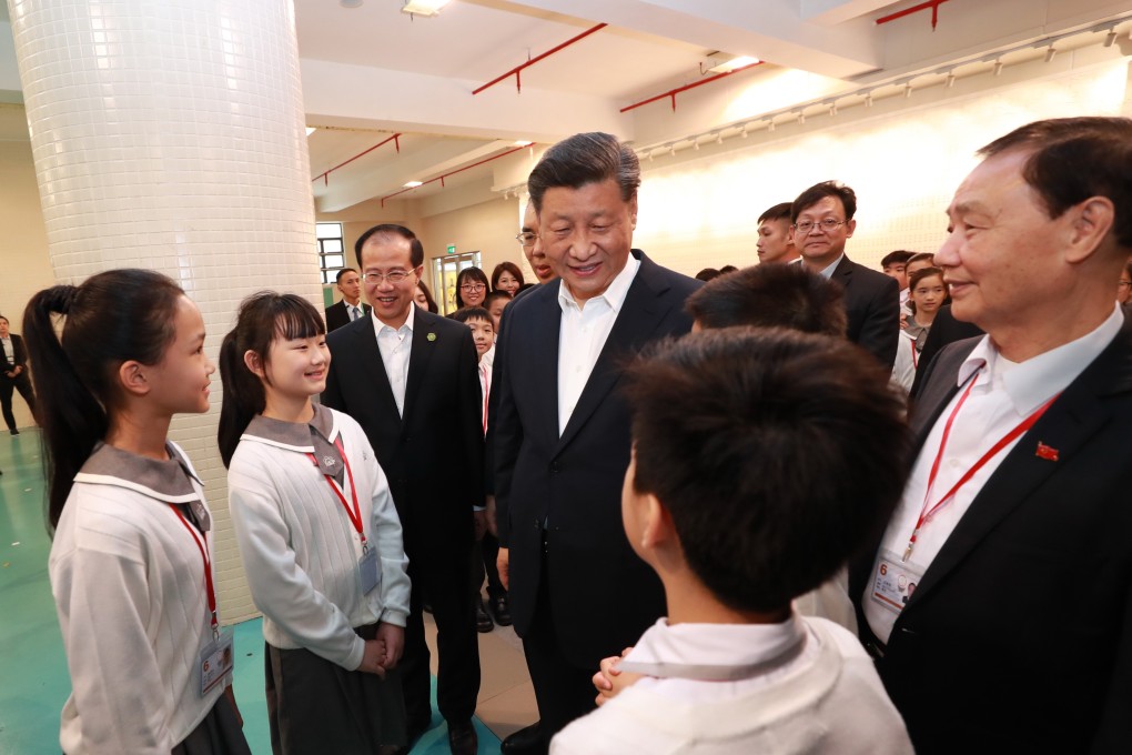 Chinese President Xi Jinping meets students and teachers at the Premier School Affiliated to Hou Kong Middle School, in Macau. Photo: Xinhua