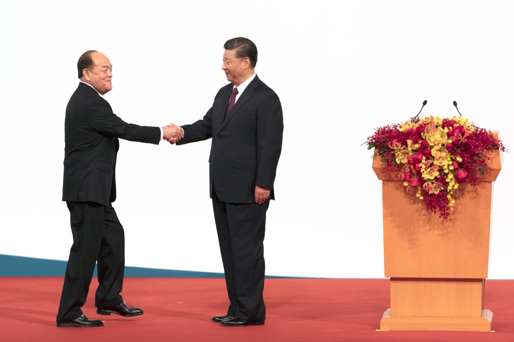 President Xi Jinping (right) with Chief Executive Ho Iat-seng said Macau’s achievements showed the importance of belief in one country, two systems. Photo: Bloomberg