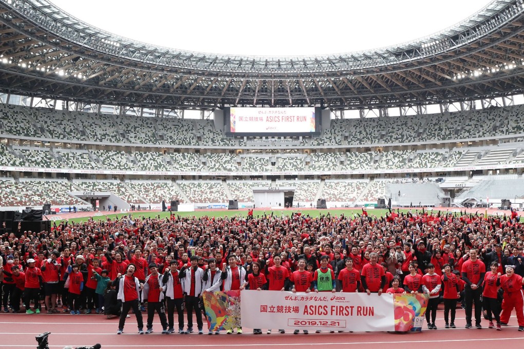 2,020 runners take to the track for a relay to celebrate the inauguration of the Tokyo National Stadium ahead of the 2020 Olympic Games. Photo: AFP