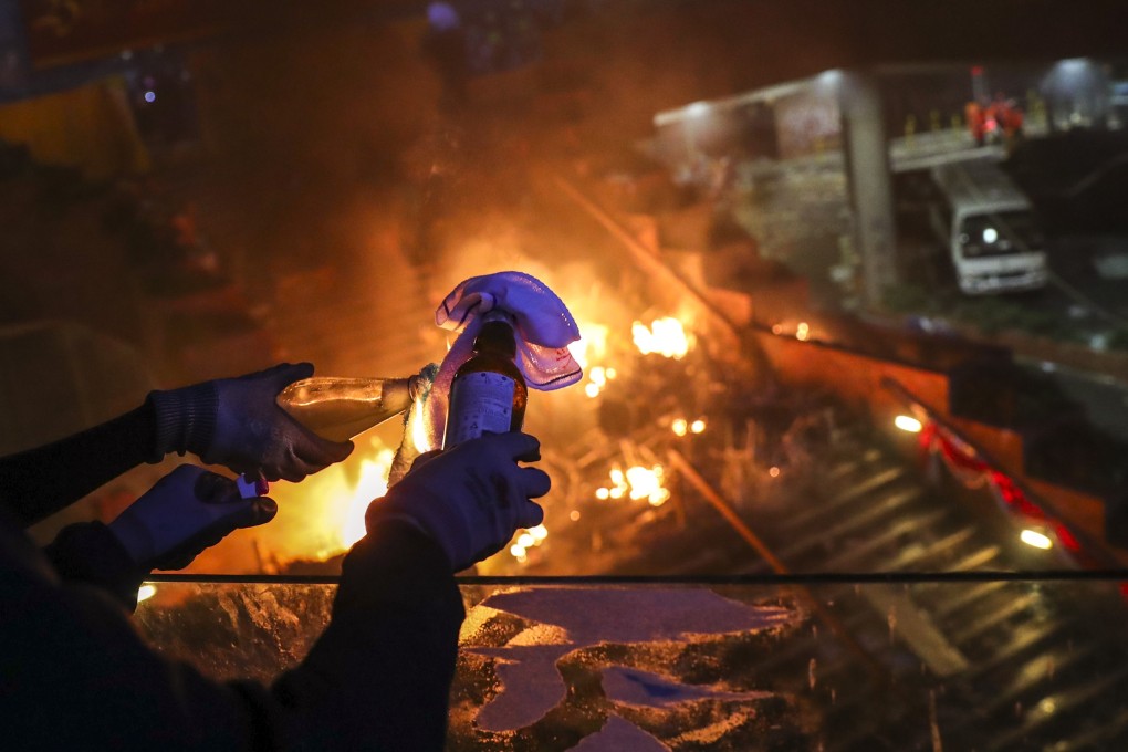 Protesters prepare a petrol bomb during clashes with police at the Polytechnic University campus in November. Photo: Sam Tsang